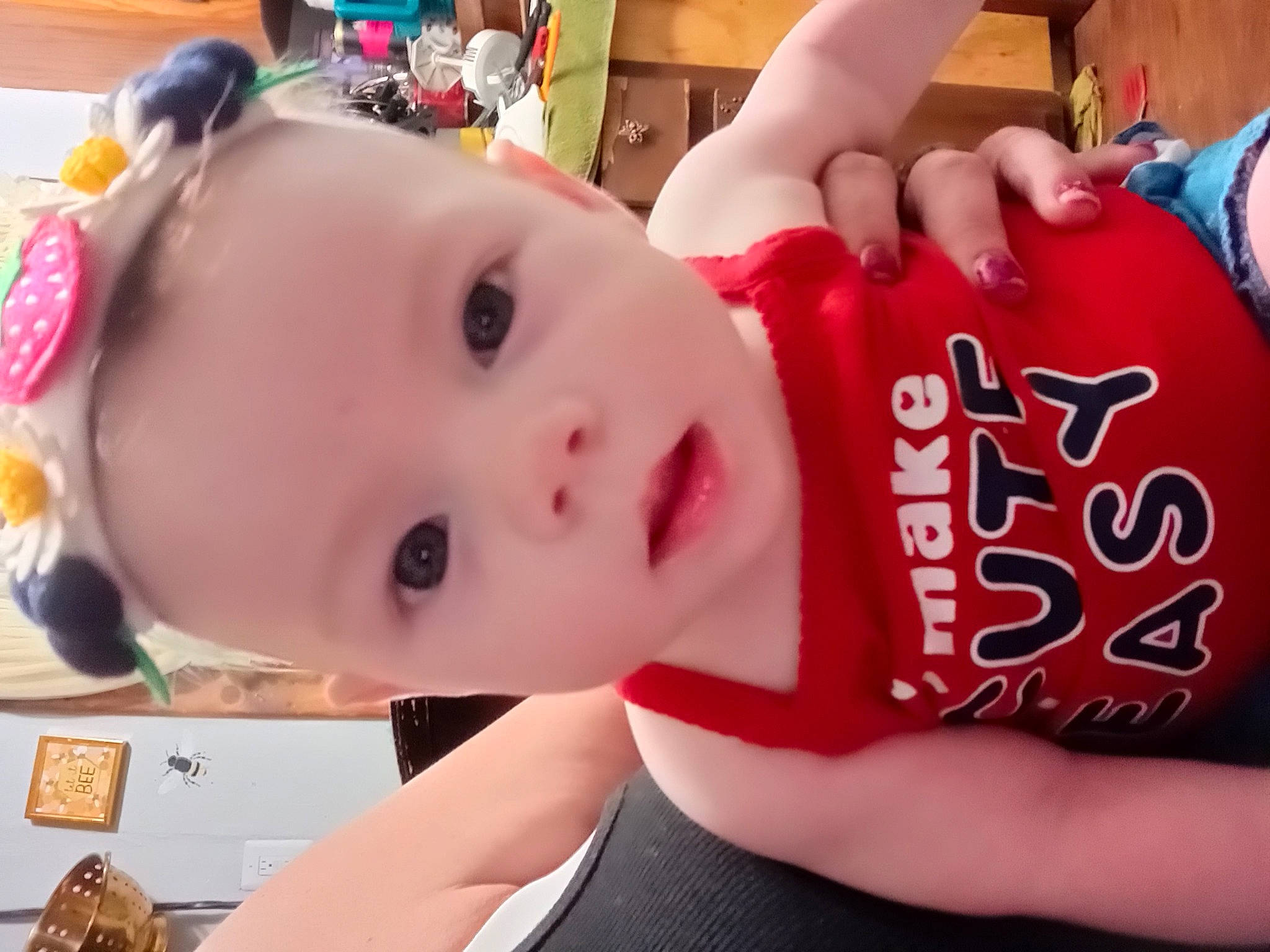 Everleigh is registered to the contest to win money with this photo: baby, baby_products, baby_toddler_clothing, carmine, cheek, child, chin, eyelash, facial_expression, fun, happy, mouth, person, room, skin, sweetness, toddler, toy