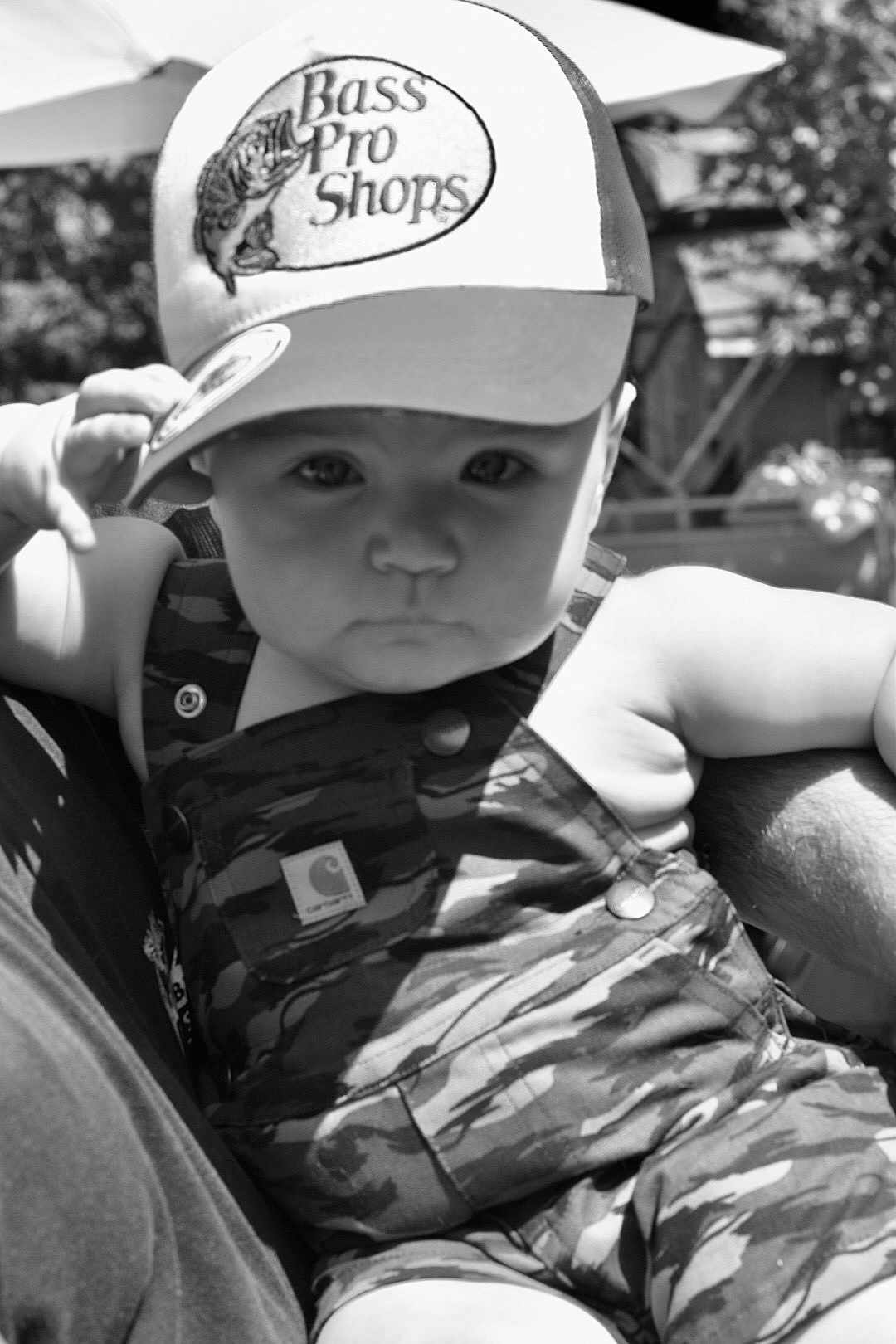 Lewis joined the competition — help win amazing prizes! baby, child, cap, hat, camouflage, overalls, outdoor, person, portrait, black_and_white, infant, face, expression, sunlight, nature, hand, candid, summer, fashion, cute