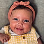 Lolie participe au concours pour gagner de l'argent avec cette photo : baby, infant, smile, headband, pink, yellow, checkered, clothing, face, happy, cute, portrait, child, skin, eyes, button, hand, closeup, person, background