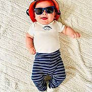 Lorenzo is registered to the contest to win money with this photo: accessories, baby, baseballcap, cap, clothing, electronics, face, glasses, goggles, hardhat, hat, head, helmet, pants, person, photography, portrait, shorts, sunglasses, t_shirt