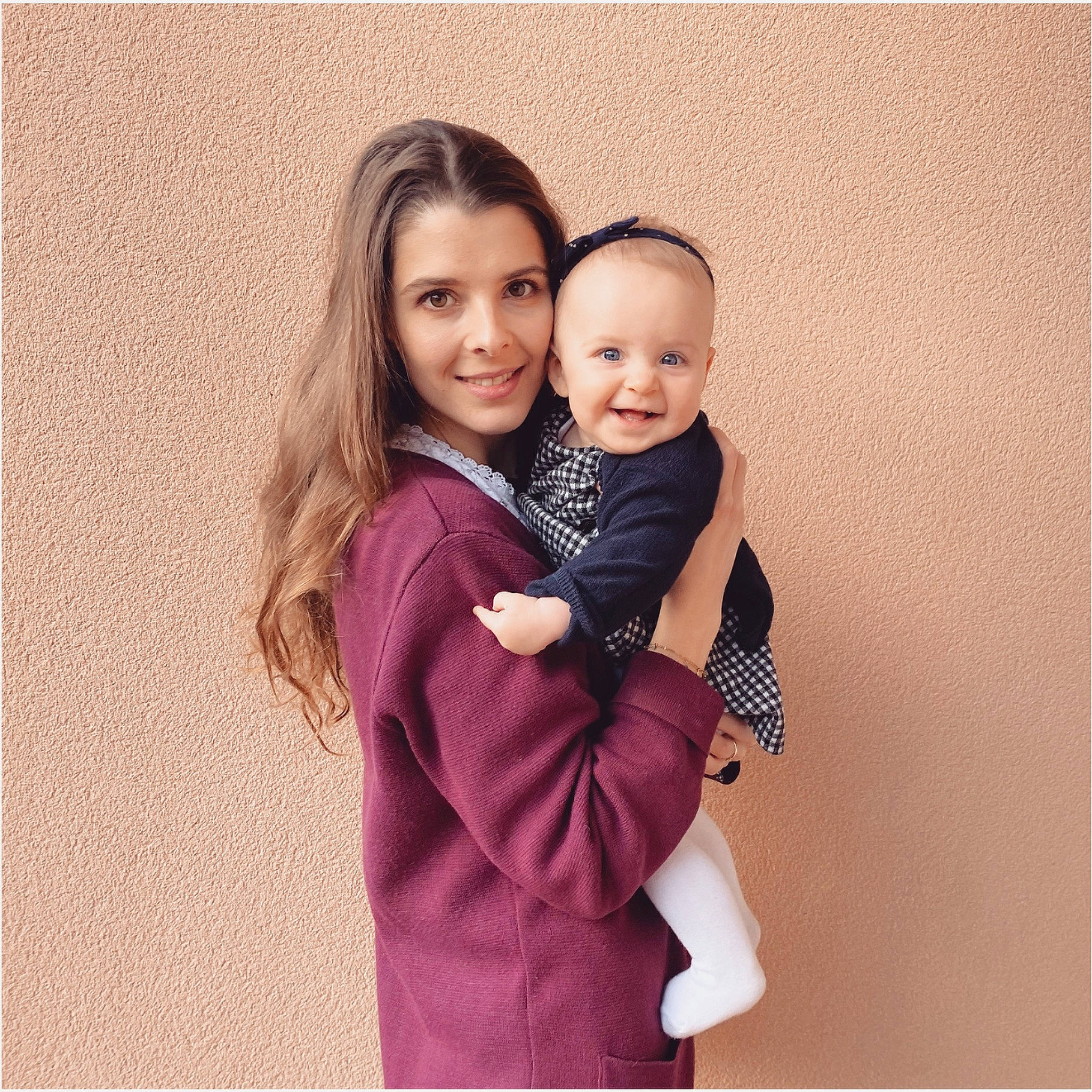 Elisabeth participe au concours pour gagner de l'argent avec cette photo : baby, blazer, collar, comfort, event, face, flash_photography, formal_wear, fur, gesture, happy, hug, joy, magenta, outerwear, person, sitting, sleeve, smile, suit