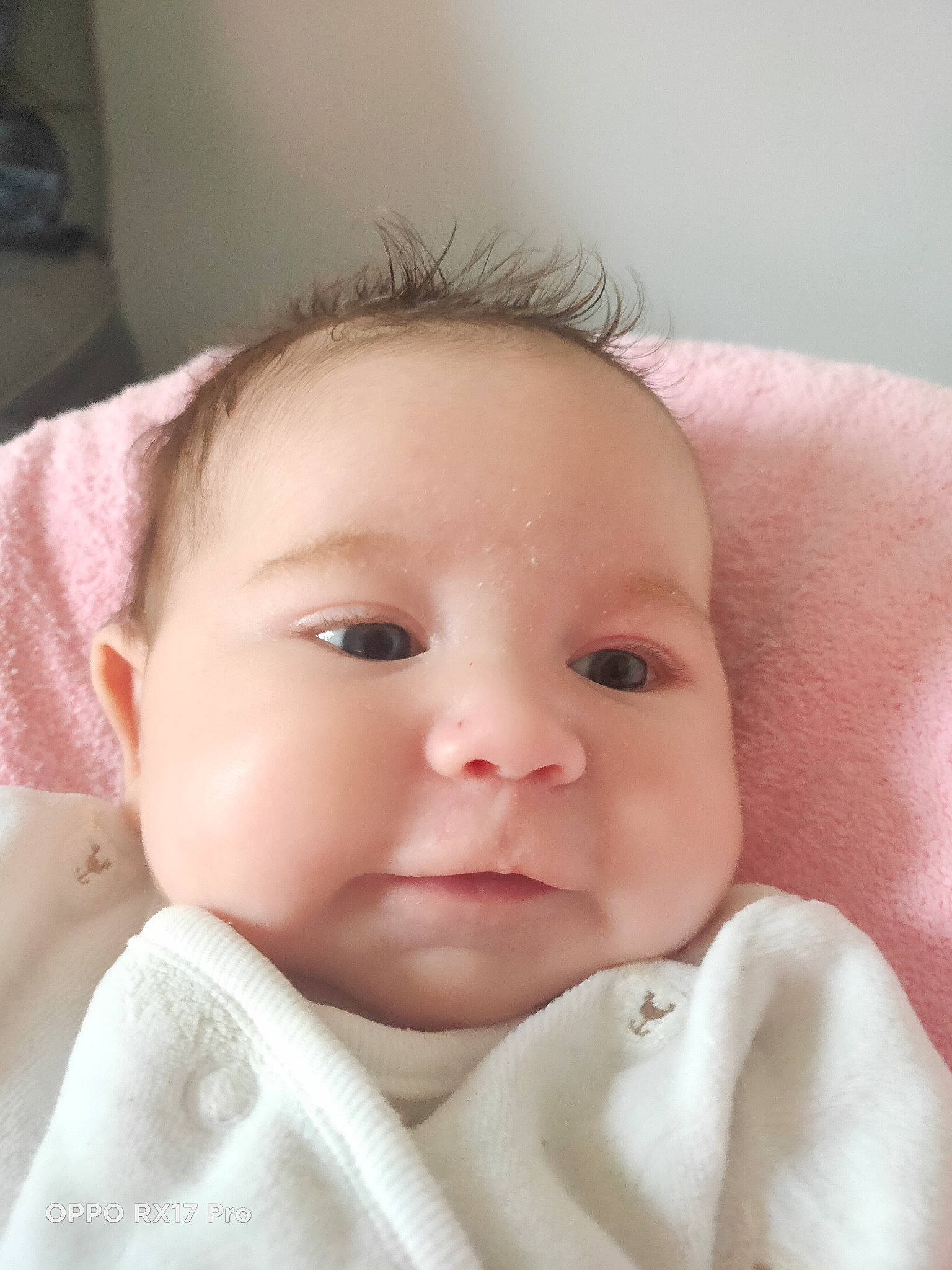 Emilia participe au concours pour gagner de l'argent avec cette photo : baby, baby_toddler_clothing, cheek, child, chin, close_up, collar, comfort, eye, eyebrow, eyelash, iris, linens, lip, neck, nose, person, pink, skin, sleeve