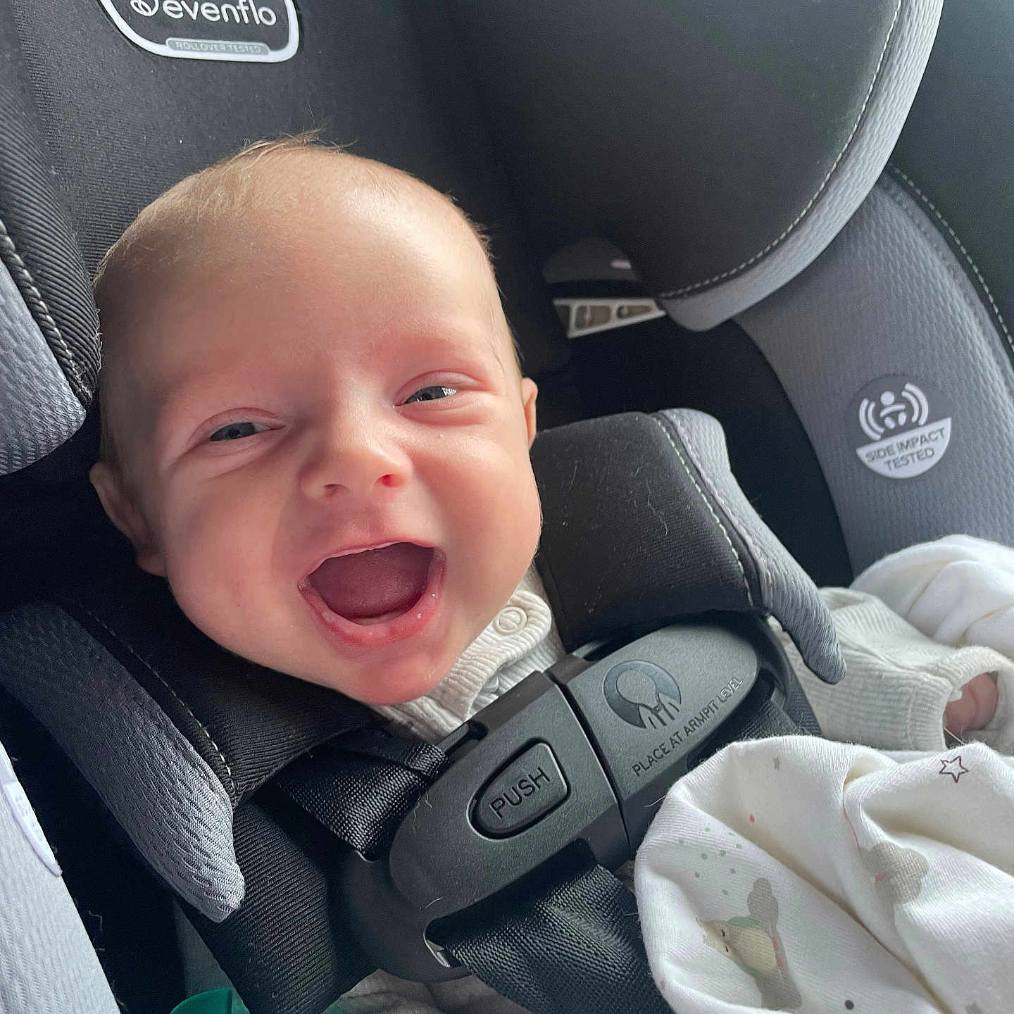Archer is registered to the contest to win money with this photo: baby, babylaughing, car, car_interior, carseat, crying, cushion, face, happy, head, homedecor, laughing, newborn, person, photography, portrait, sad, smile, transportation, vehicle