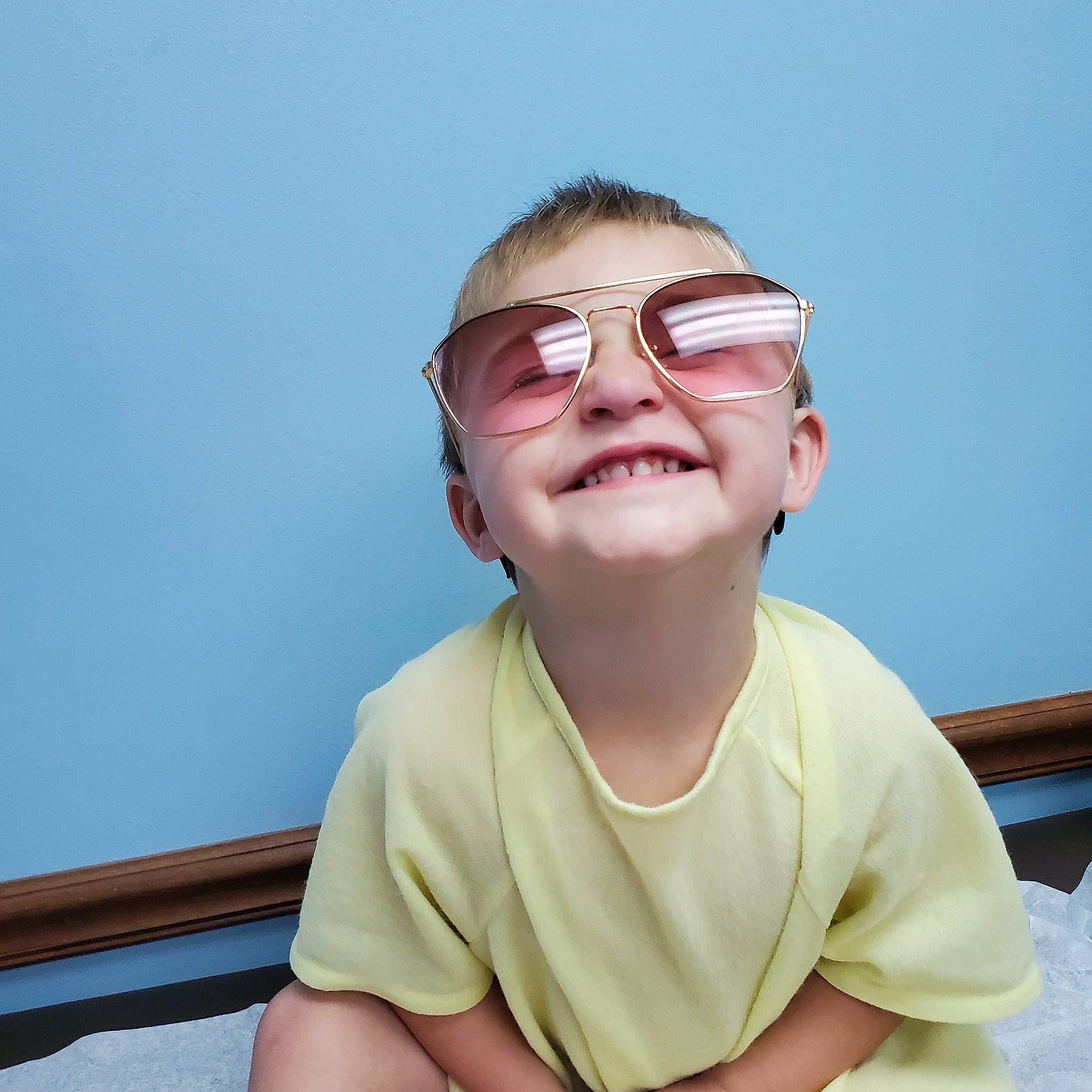 Kaison joined the competition — help win amazing prizes! comfort, elbow, electric_blue, eyewear, fun, gesture, happy, jaw, joy, laugh, leisure, neck, person, personal_protective_equipment, sitting, sky, sleeve, smile, thumb, toddler