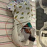 baby, bed, blanket, breathing_mask, care, cute, healthcare, hospital, incubator, infant, lying_down, medical, newborn, nursery, patient, small, striped, swaddle, tube, wrapped