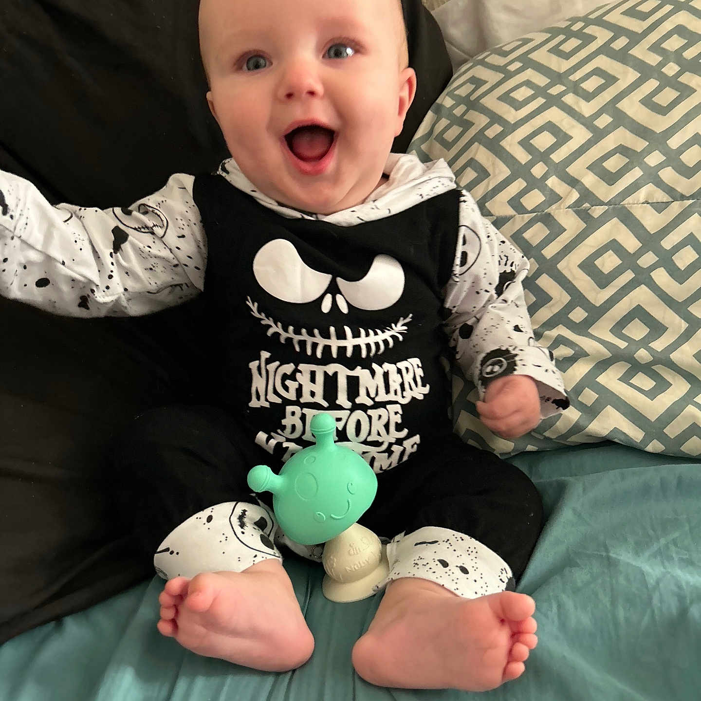 Scott is registered to the contest to win money with this photo: baby, babylaughing, bed, bedroom, clothing, couch, cushion, face, furniture, happy, head, homedecor, indoors, person, photography, pillow, portrait, room, sitting, t_shirt