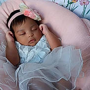 Monroe'Blu is registered to the contest to win money with this photo: baby, child, cozy, cushion, cute, dress, floral_wallpaper, flower, foot, hand, headband, indoor, infant, lace, peaceful, pink, portrait, resting, sleeping, soft