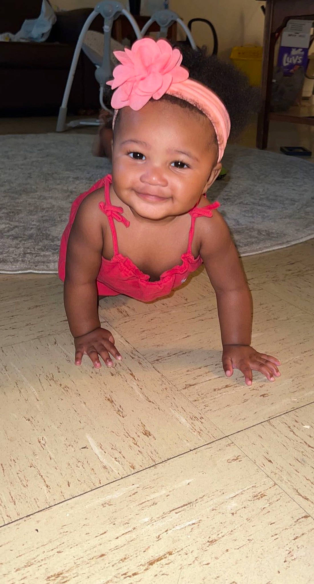 Tanayah is registered to the contest to win money with this photo: baby, baby_laughing, baby_toddler_clothing, cheek, child, crawling, face, fashion_accessory, floor, flooring, fun, happy, hardwood, headgear, headpiece, joy, magenta, person, pink, smile