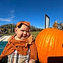 Solana is registered to the contest to win money with this photo: baby, child, pumpkin, outdoor, autumn, headband, smile, blue_sky, field, tractor, plaid, orange, cute, fall, nature, person, daylight, rural, happy, seasonal