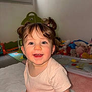 Elena a rejoint le concours — aidez-le/la à gagner de superbes lots ! child, toddler, baby, smile, pigtails, pink_toy, onesie, playroom, toys, plush_toys, blanket, cheeks, teeth, portrait, indoor, window, mat, happy, sitting, close_up