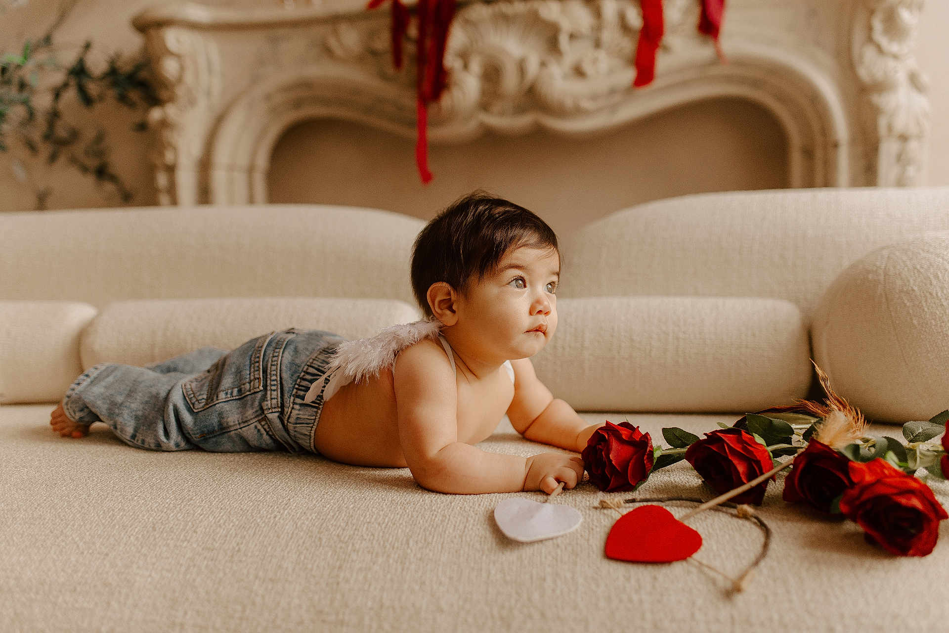 Lorenzo is registered to the contest to win money with this photo: baby, infant, angel_wings, roses, heart_shapes, couch, indoor, curious, portrait, child, soft_lighting, decor, cozy, cute, jeans, bare_chest, homedecor, flower, valentine, love