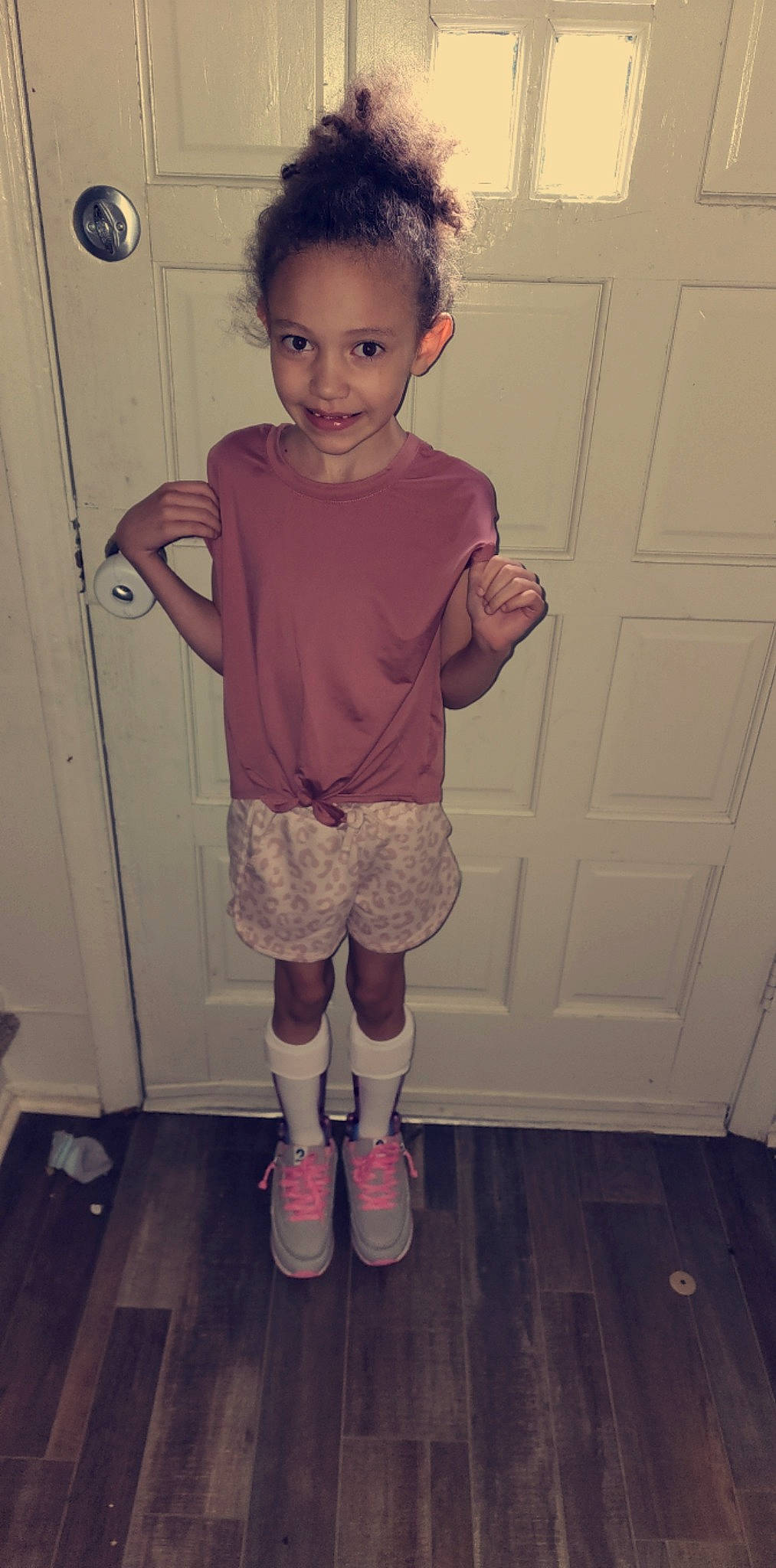 Aaliyah joined the competition — help win amazing prizes! baby_toddler_clothing, door, dress, face, flooring, happy, joy, knee, leg, neck, person, photograph, pink, shoe, shorts, sleeve, smile, sneakers, standing, thigh