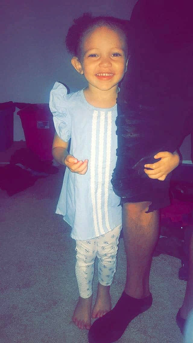 Aaliyah is registered to the contest to win money with this photo: child, face, fun, head, joy, long_hair, person, pink, play, purple, shoe, shoulder, skin, smile, standing, toddler, vacation