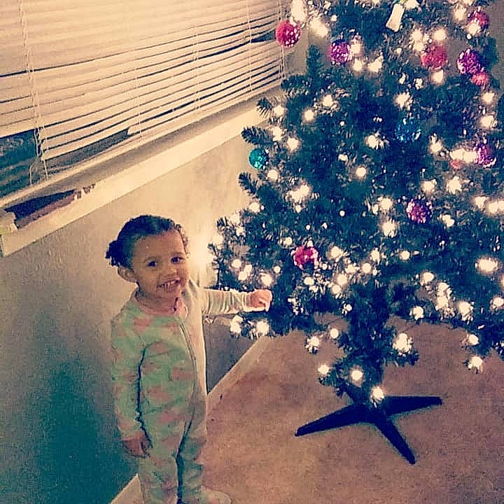 Aiyanna joined the competition — help win amazing prizes! child, christmas, christmas_decoration, christmas_eve, christmas_ornament, christmas_tree, cloud, cool, fun, happy, holiday, interior_design, joy, person, plant, selfie, sky, smile, standing, toddler