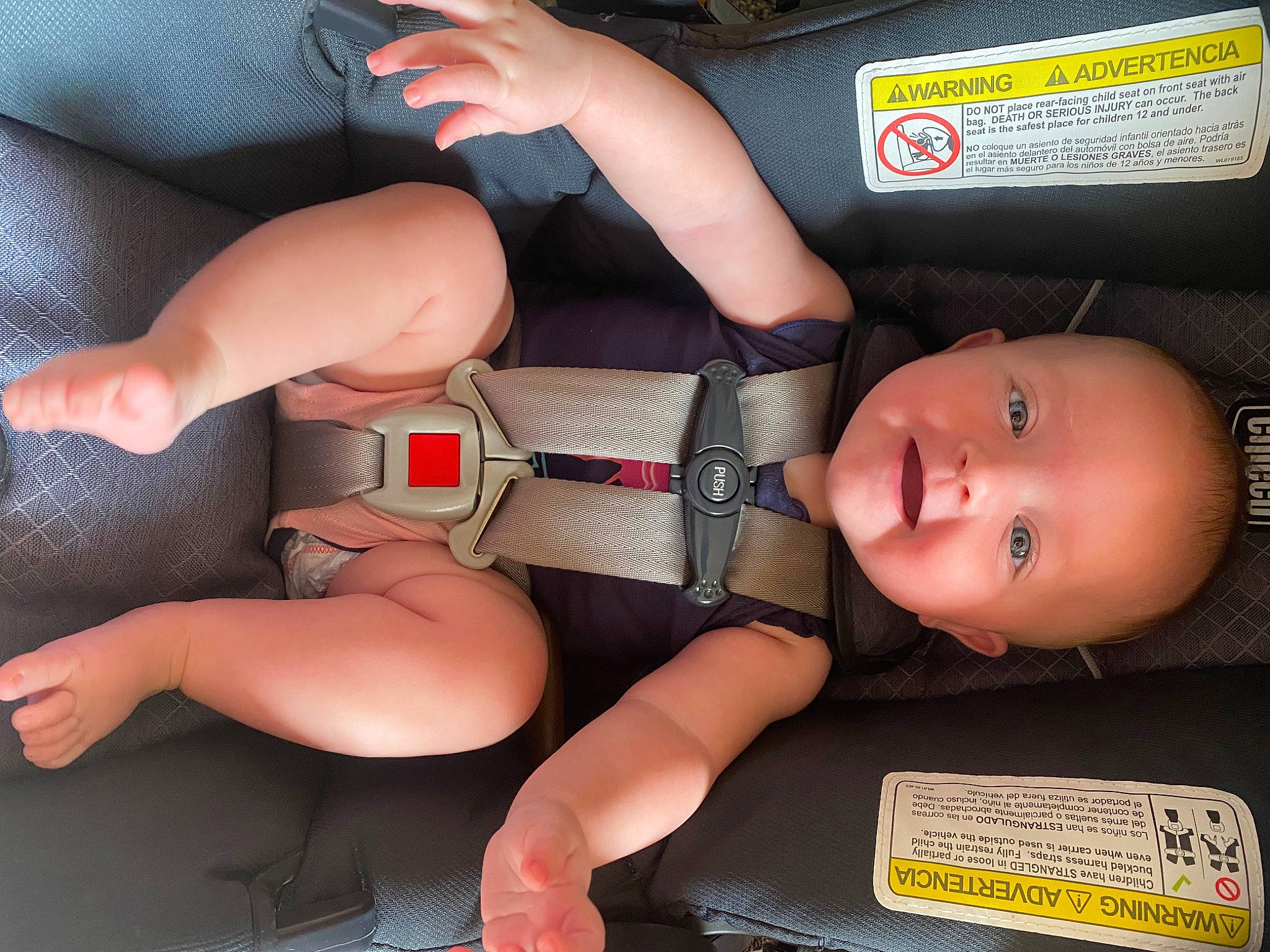 Isobel is registered to the contest to win money with this photo: abdomen, auto_part, car_seat, chest, comfort, elbow, finger, human_body, human_leg, joint, knee, leg, mouth, muscle, nail, person, thigh, thumb, toy, trunk