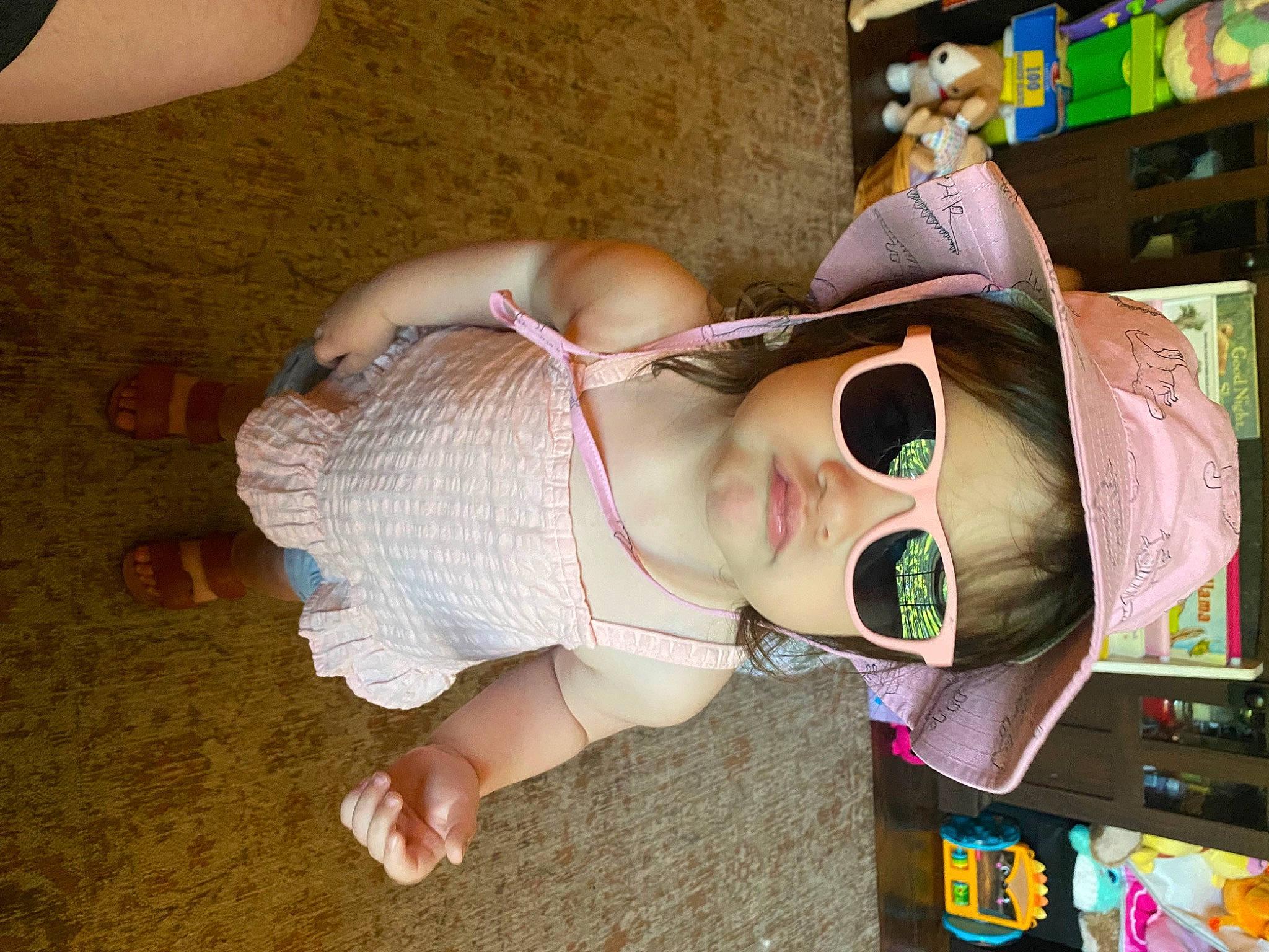 Emilia joined the competition — help win amazing prizes! animation, baby, black_hair, child, doll, eyelash, eyewear, fun, human_leg, leisure, mouth, person, publication, room, shelf, stuffed_toy, sunglasses, thigh, toddler, toy