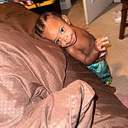 Ahmilliyonn joined the competition — help win amazing prizes! child, toddler, smiling, portrait, indoor, bedroom, bed, blanket, couch, carpet, braids, earring, shirtless, pants, playful, peeking, face, furniture, home, photography