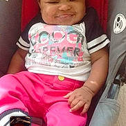 Elaysha is registered to the contest to win money with this photo: baby, car_seat, pink_pants, colorful_shirt, smiling, child, infant, phone_screen, selfie, indoor, casual_clothing, seatbelt, happy, cute, person, portrait, resting, digital_device, technology, infant_clothing