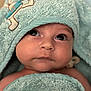 Lyo participe au concours pour gagner de l'argent avec cette photo : baby, child, face, eyes, towel, hood, soft_texture, cute, infant, skin, portrait, closeup, expression, adorable, wrapped, blue, cloth, newborn, person, young