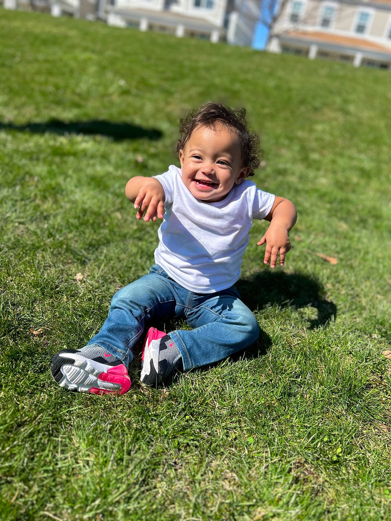 Kahlani is registered to the contest to win money with this photo: baby_toddler_clothing, fun, grass, grass_family, grassland, groundcover, happy, jeans, joy, lawn, leisure, meadow, people_in_nature, person, plant, playing_with_kids, recreation, shorts, smile, toddler