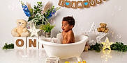Dejai joined the competition — help win amazing prizes! baby, bathtub, bubbles, celebration, child, decorations, duck, first_birthday, flowers, indoor, light, plant, rubber_duck, smiling, star_lights, teddy_bear, toy, water, white_background, young_child
