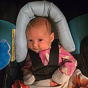 Luna joined the competition — help win amazing prizes! baby, blanket, car_seat, child, clothing, cute, expression, face, headrest, indoors, infant, mittens, newborn, person, pink_onesie, portrait, safety, seat, seatbelt, soft_lighting