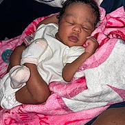 Rumani is registered to the contest to win money with this photo: newborn, baby, sleeping, infant, portrait, face, curled_up, blanket, pink_blanket, white_clothing, onesie, mittens, bed, bedding, pacifier, peaceful, indoors, close_up, resting, adorable