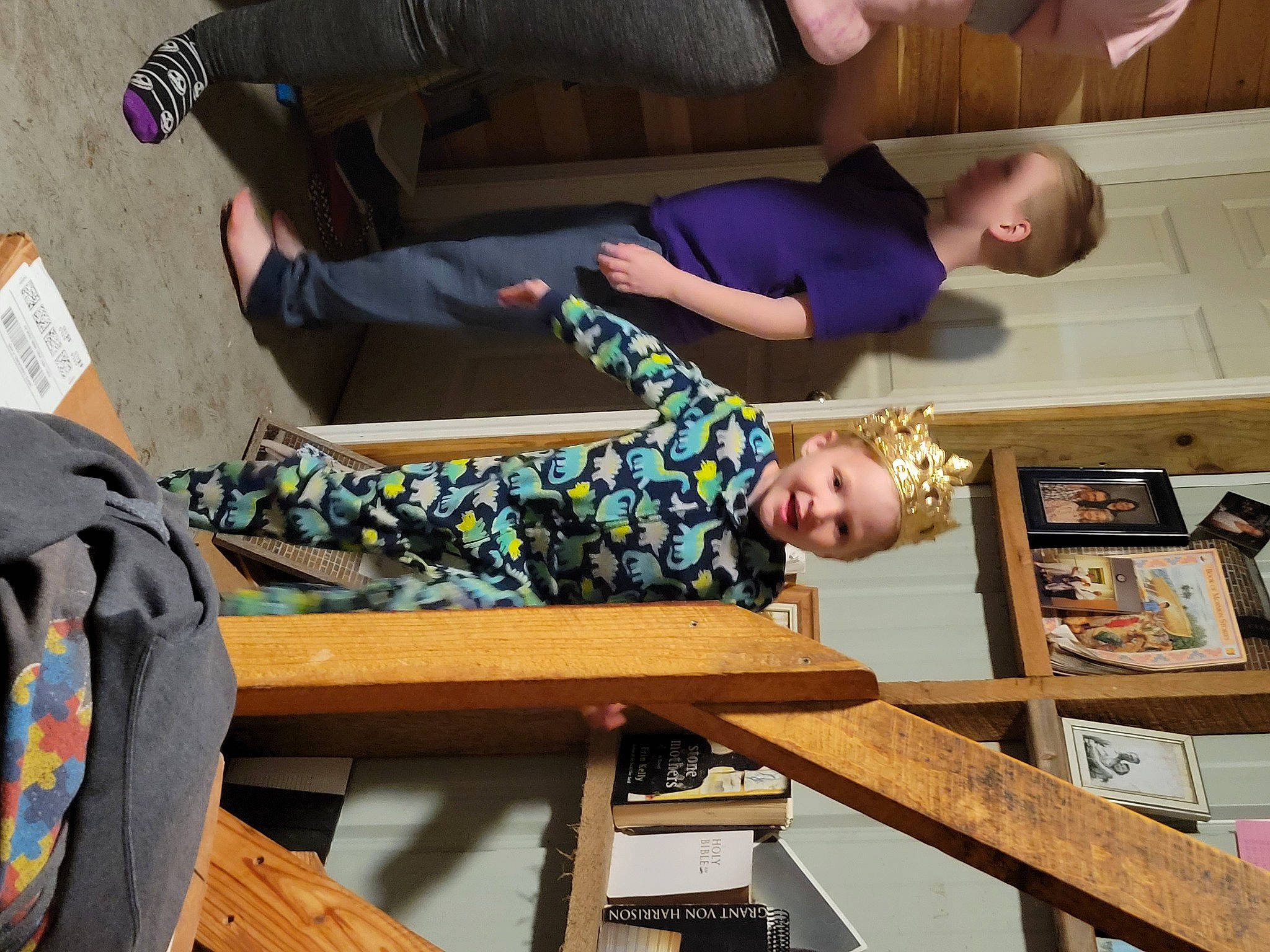 Lachlan is registered to the contest to win money with this photo: arm, backpack, bag, comfort, event, fun, hardwood, headwear, joint, leisure, luggage_and_bags, person, room, sitting, visual_arts, wood, wrist