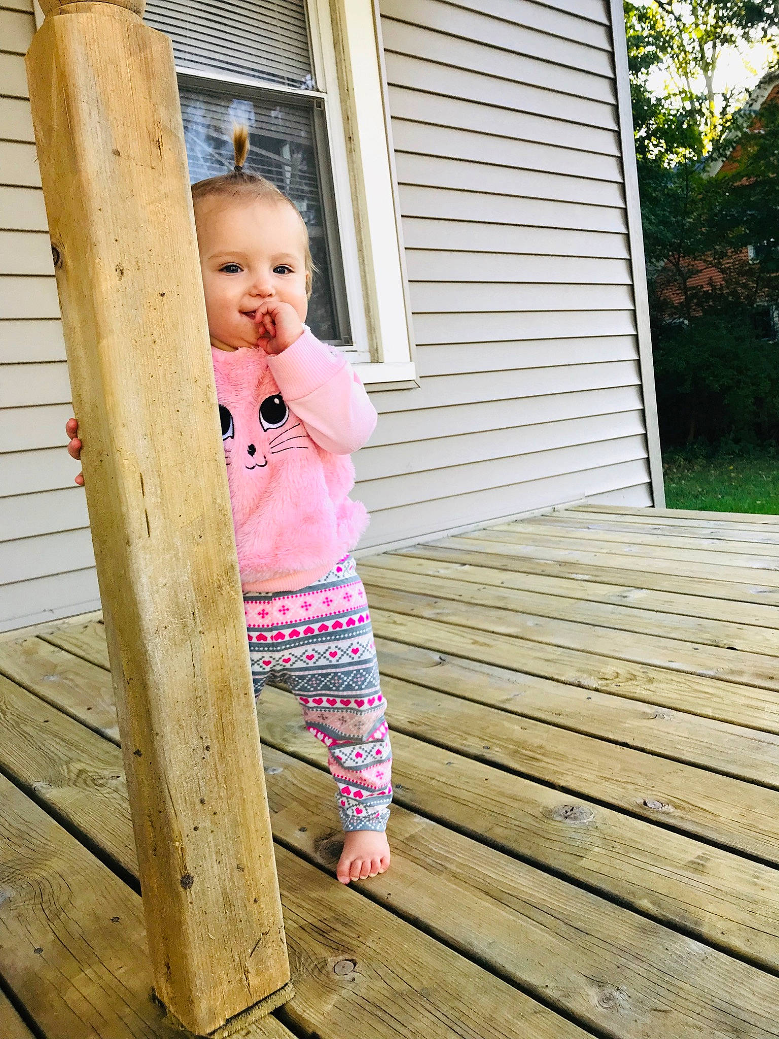 Zoey is registered to the contest to win money with this photo: baby, beauty, child, child_model, home, leisure, person, photograph, photography, pink, skin, standing, toddler, vacation, wood