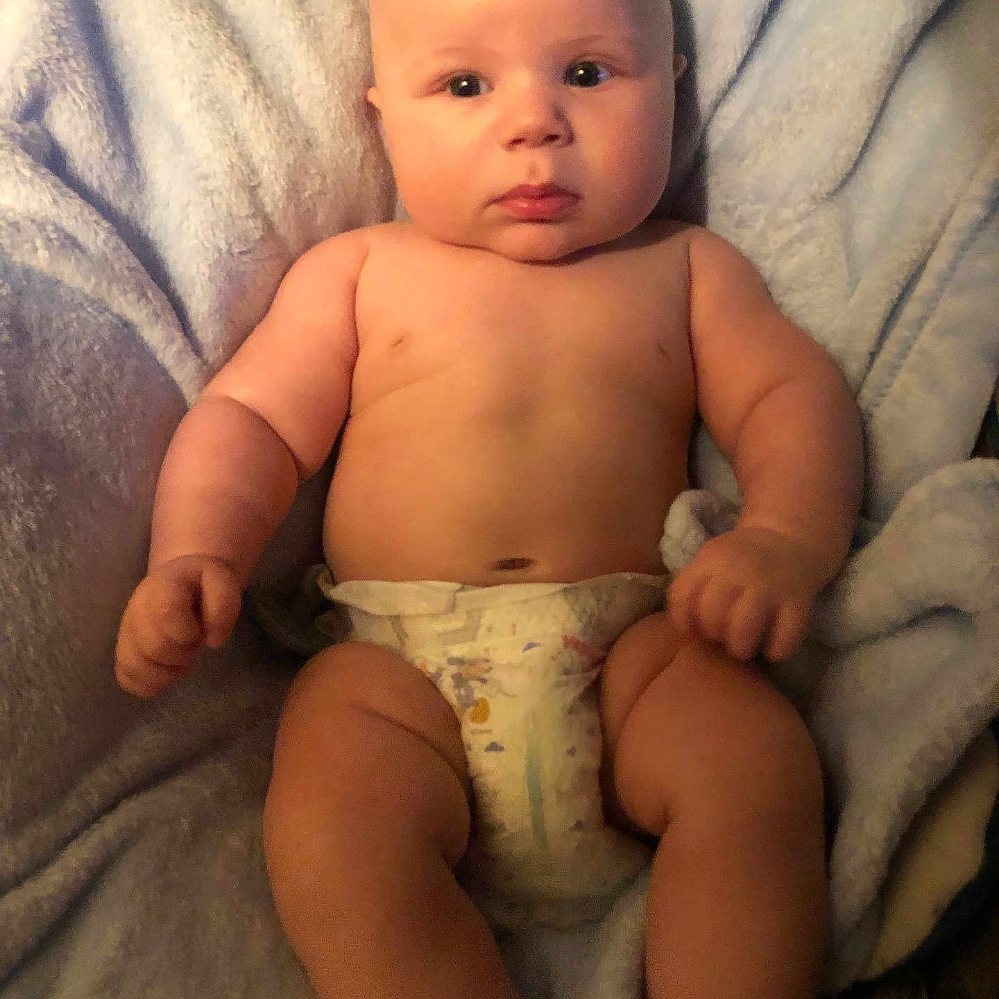 Liam is registered to the contest to win money with this photo: baby, bed, blanket, bodypart, cushion, diaper, face, finger, furniture, hand, head, homedecor, newborn, person, photography, portrait, quilt, sitting, standing, towel