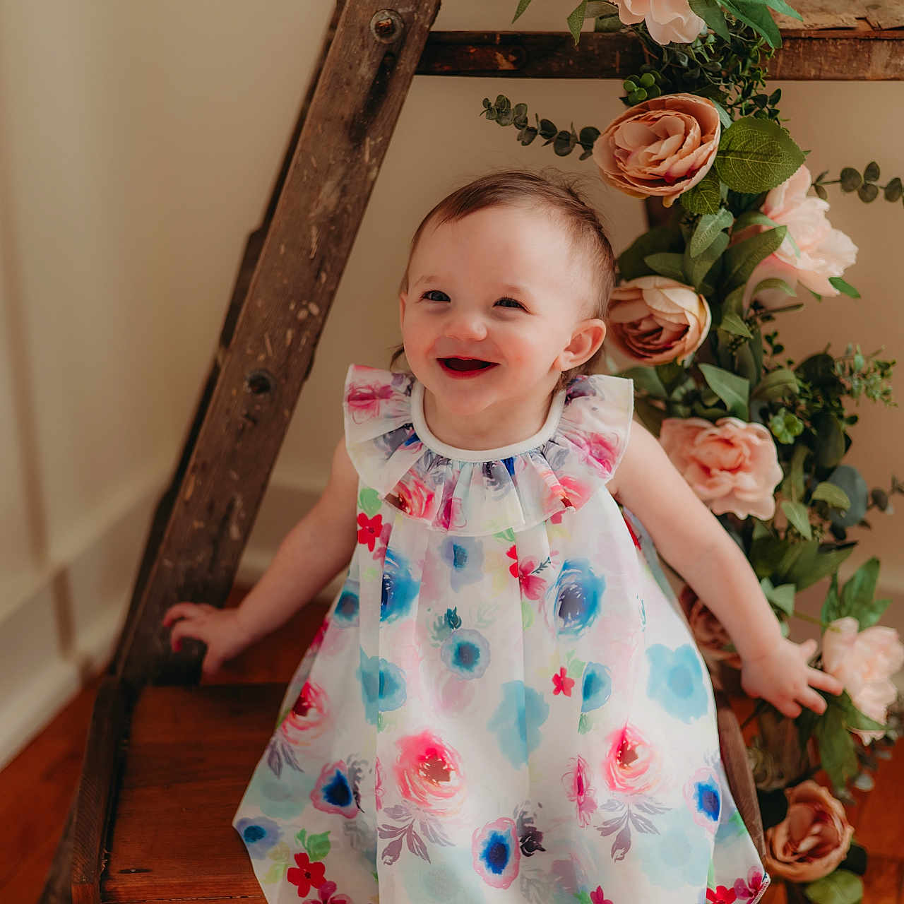 Nevaeh is registered to the contest to win money with this photo: baby, clothing, dress, face, flower, flowerarrangement, flowerbouquet, footwear, formalwear, handrail, hardwood, head, pattern, person, photography, plant, portrait, rose, shoe, wood