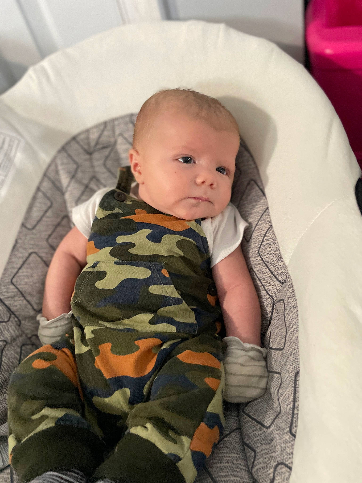 Ezekiel is registered to the contest to win money with this photo: baby, baby_products, baby_toddler_clothing, camouflage, cheek, child, comfort, eye, linens, military_camouflage, military_uniform, pattern, person, room, sitting, skin, sleeve, soldier, thigh, toddler
