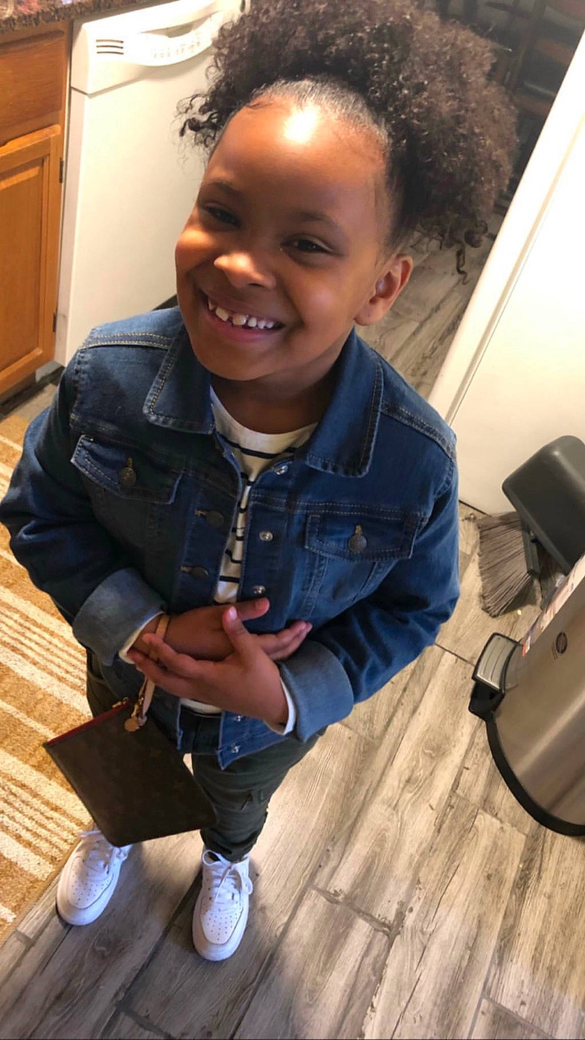 Autymn is registered to the contest to win money with this photo: baby_toddler_clothing, cabinetry, cheek, child, cool, denim, facial_expression, forehead, hairstyle, happy, hardwood, jacket, jeans, jheri_curl, joy, mouth, outerwear, person, shoe, style