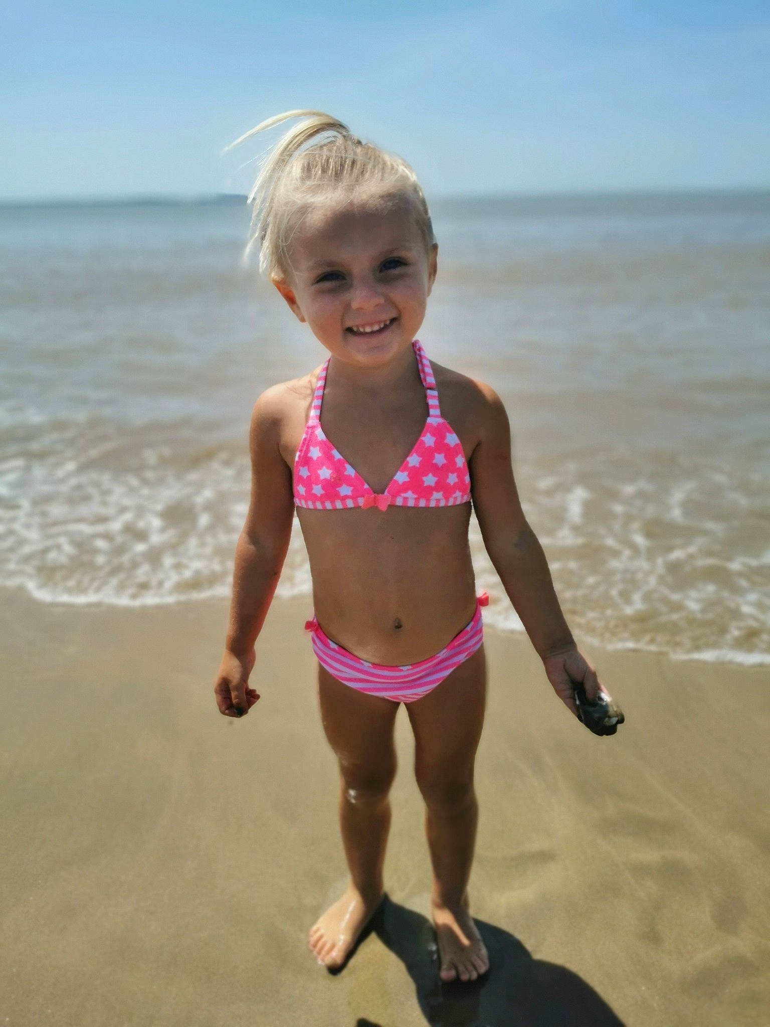 Ashley participe au concours pour gagner de l'argent avec cette photo : beach, brassiere, chest, face, fun, happy, joy, leisure, people_on_beach, person, sky, smile, summer, swimsuit_bottom, swimsuit_top, swimwear, thigh, toddler, undergarment, underpants