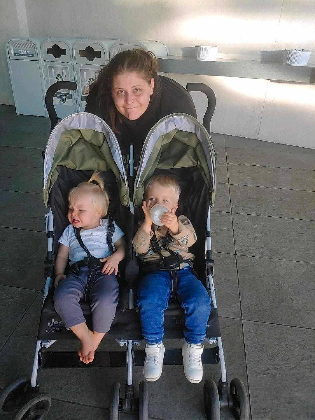 Elaine And Hubert joined the competition — help win amazing prizes! auto_part, baby, baby_carriage, baby_products, baby_safety, baby_toddler_clothing, child, comfort, electric_blue, eye, fun, joy, lap, person, rolling, sitting, tire, toddler, travel, wheel