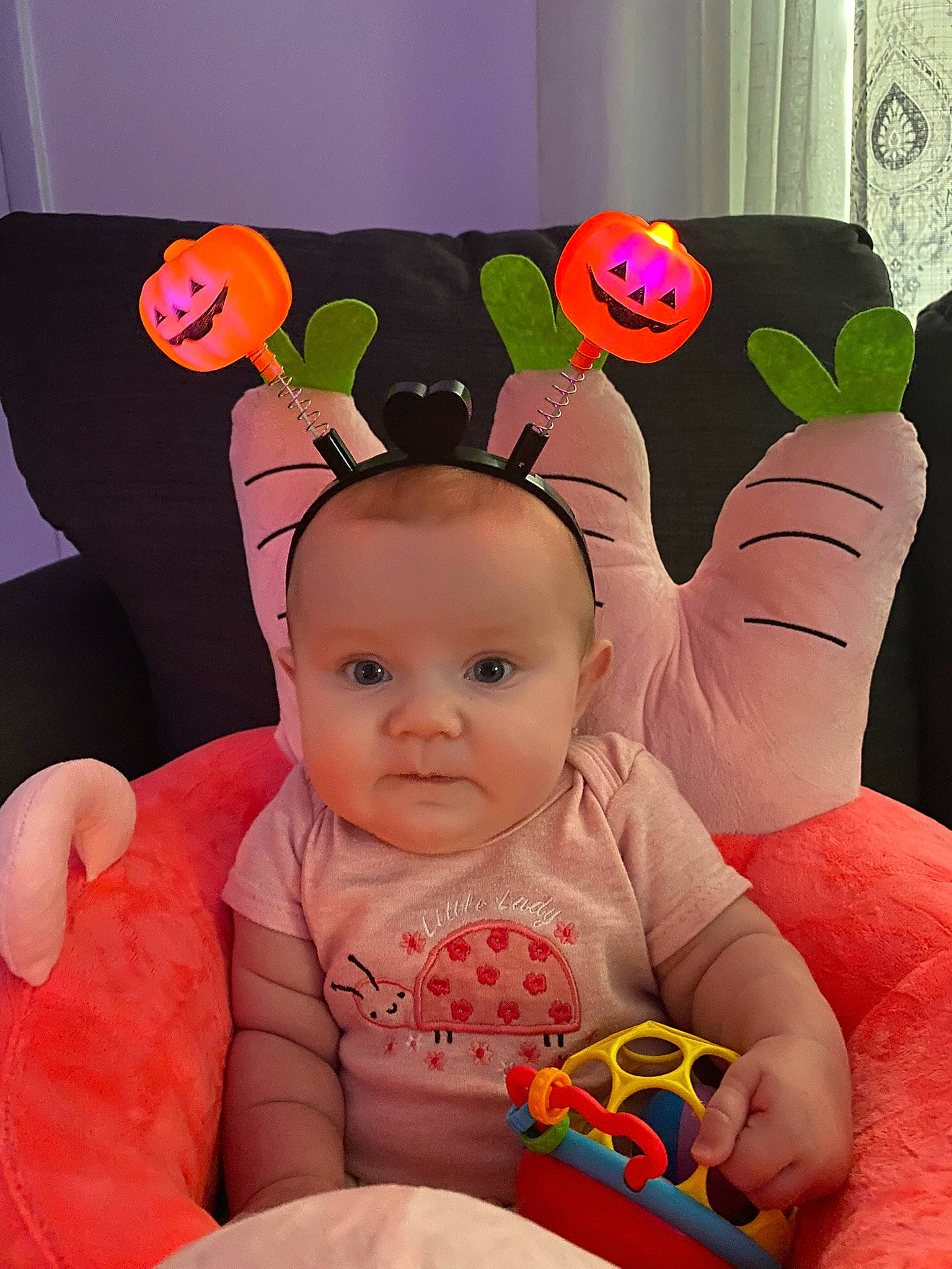 Olivia is registered to the contest to win money with this photo: baby, baby_playing_with_toys, baby_products, baby_sleeping, baby_toddler_clothing, cheek, child, comfort, finger, fun, happy, orange, person, pink, playing_with_kids, product, room, sitting, textile, toddler