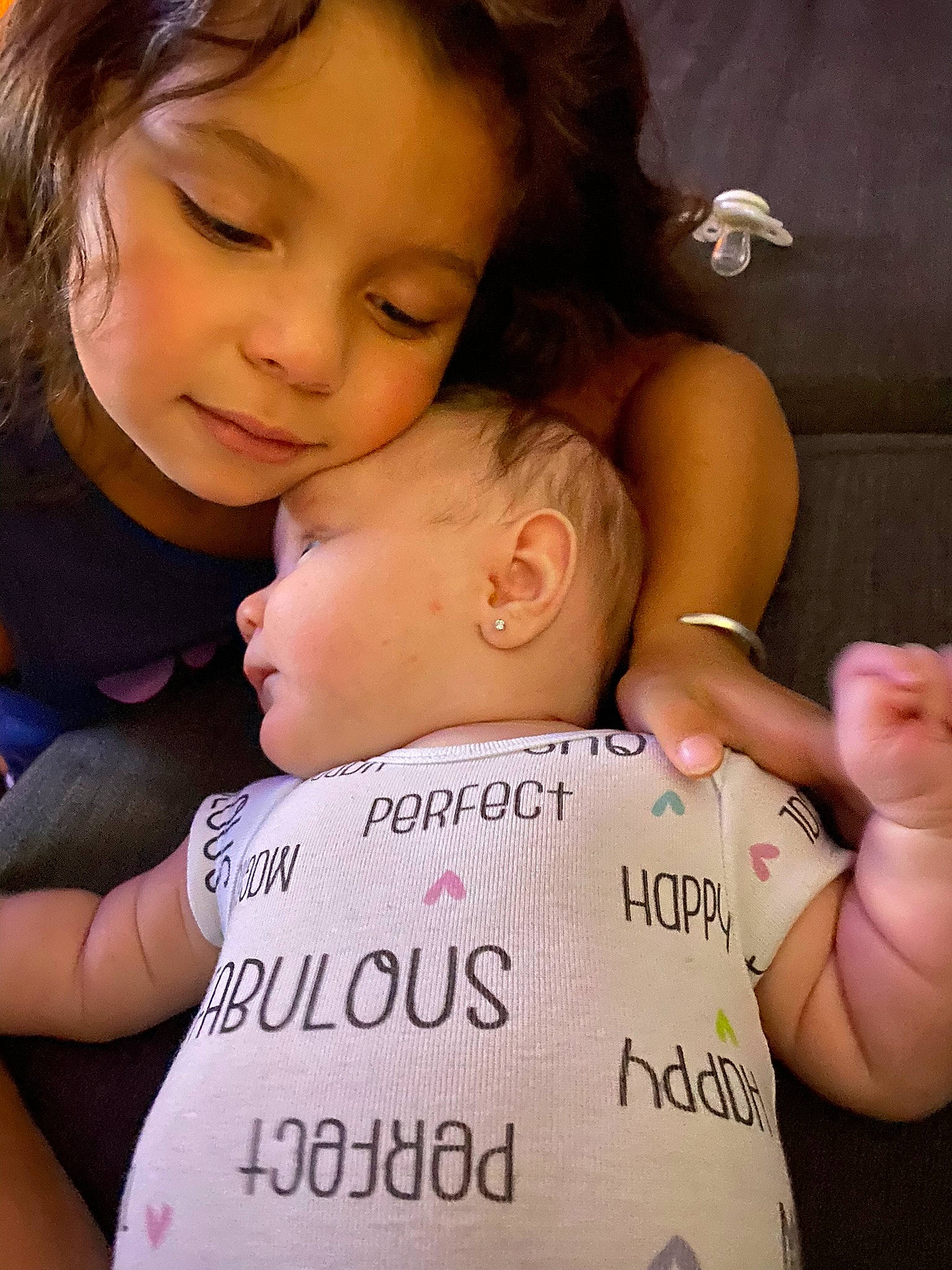 Felicity is registered to the contest to win money with this photo: baby, cheek, child, eyelash, facial_expression, finger, fun, gesture, hairstyle, hand, happy, hug, interaction, love, nail, nose, person, skin, smile, thumb