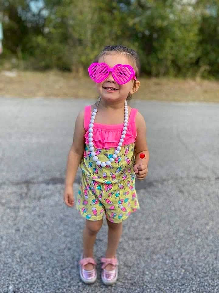 Kaydence joined the competition — help win amazing prizes! asphalt, baby_toddler_clothing, dress, eye, face, grass, hair, happy, head, headgear, joy, magenta, people_in_nature, person, personal_protective_equipment, pink, plant, recreation, road_surface, smile