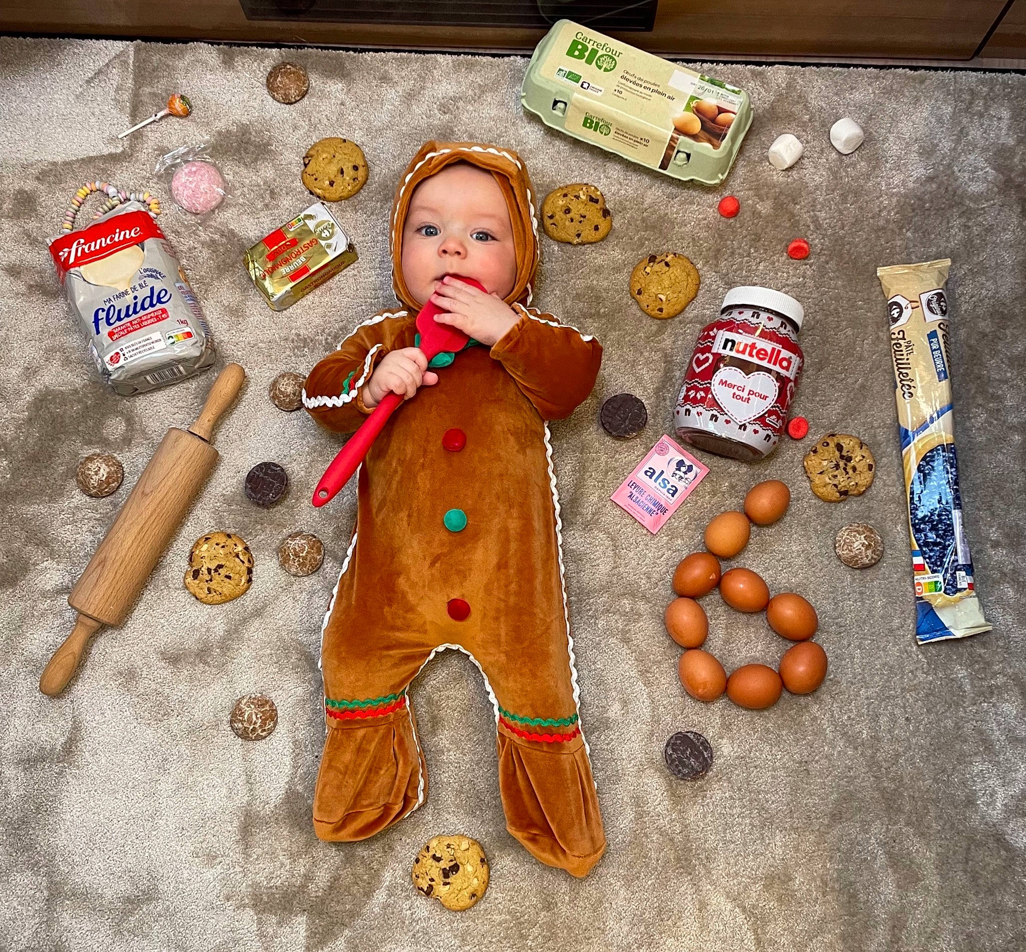 Connor participe au concours pour gagner de l'argent avec cette photo : baby_toddler_clothing, baby_toys, calabaza, child, doll, flooring, fur, headwear, junk_food, natural_foods, orange, person, plush, pumpkin, sitting, snack, stuffed_toy, teddy_bear, toddler, toy