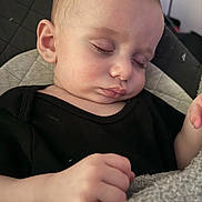 Tony joined the competition — help win amazing prizes! baby, sleeping, face, hand, black_clothing, blanket, closeup, child, peaceful, infant, resting, indoors, portrait, soft_texture, cute, young, skin, eyelashes, head, nap