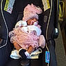baby, infant, car_seat, pink_clothing, hat, pacifier, socks, blanket, sleeping, indoors, safety_warning, infant_carrier, newborn, cute, tulle_skirt, child, resting, protectplus, snugride, seat_belt