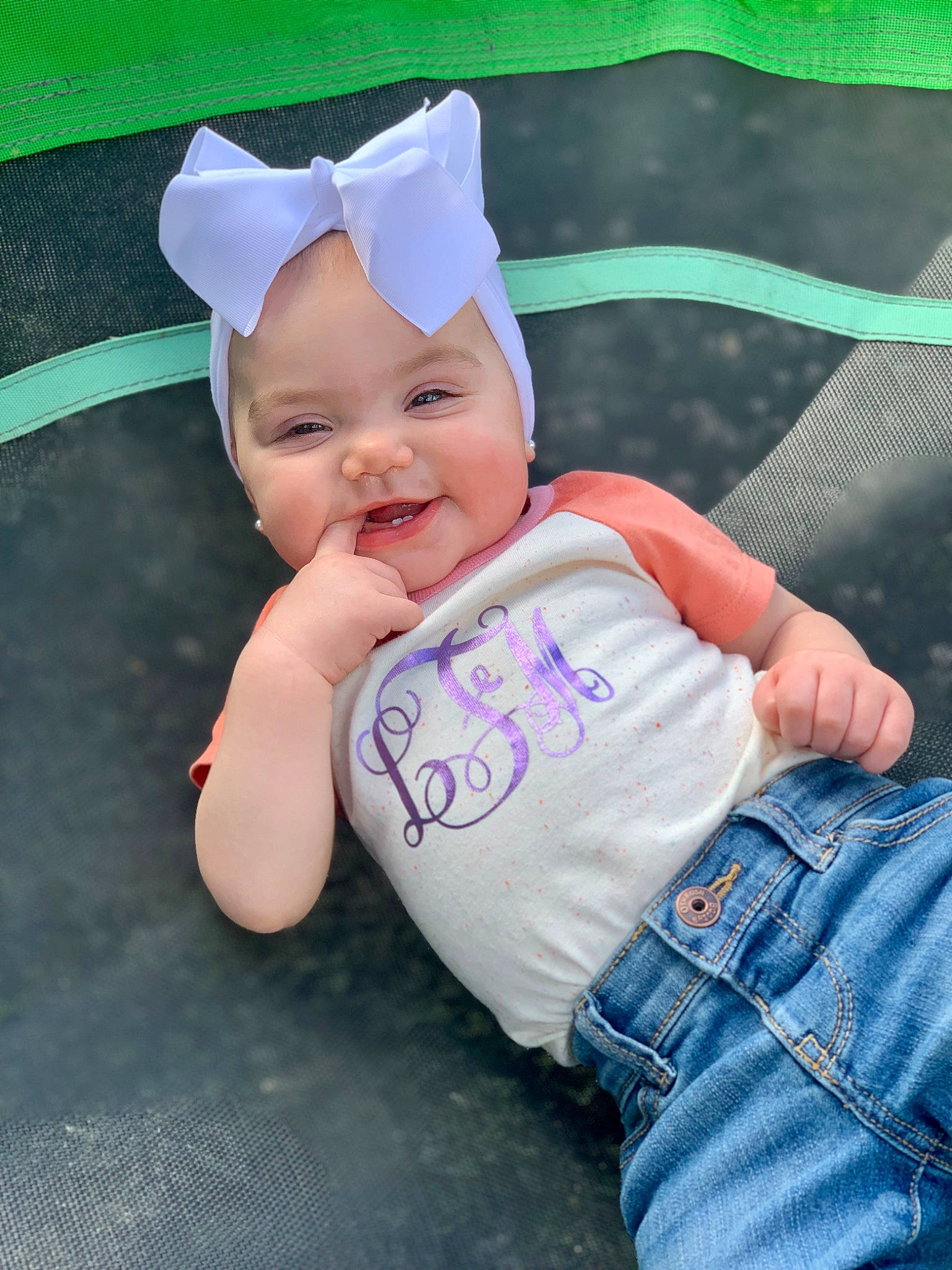 Lylah joined the competition — help win amazing prizes! baby, baby_laughing, baby_toddler_clothing, cap, child, clothing, costume_hat, denim, fashion_accessory, grass, happy, hat, headwear, human_body, pattern, person, sitting, skin, sleeve, smile