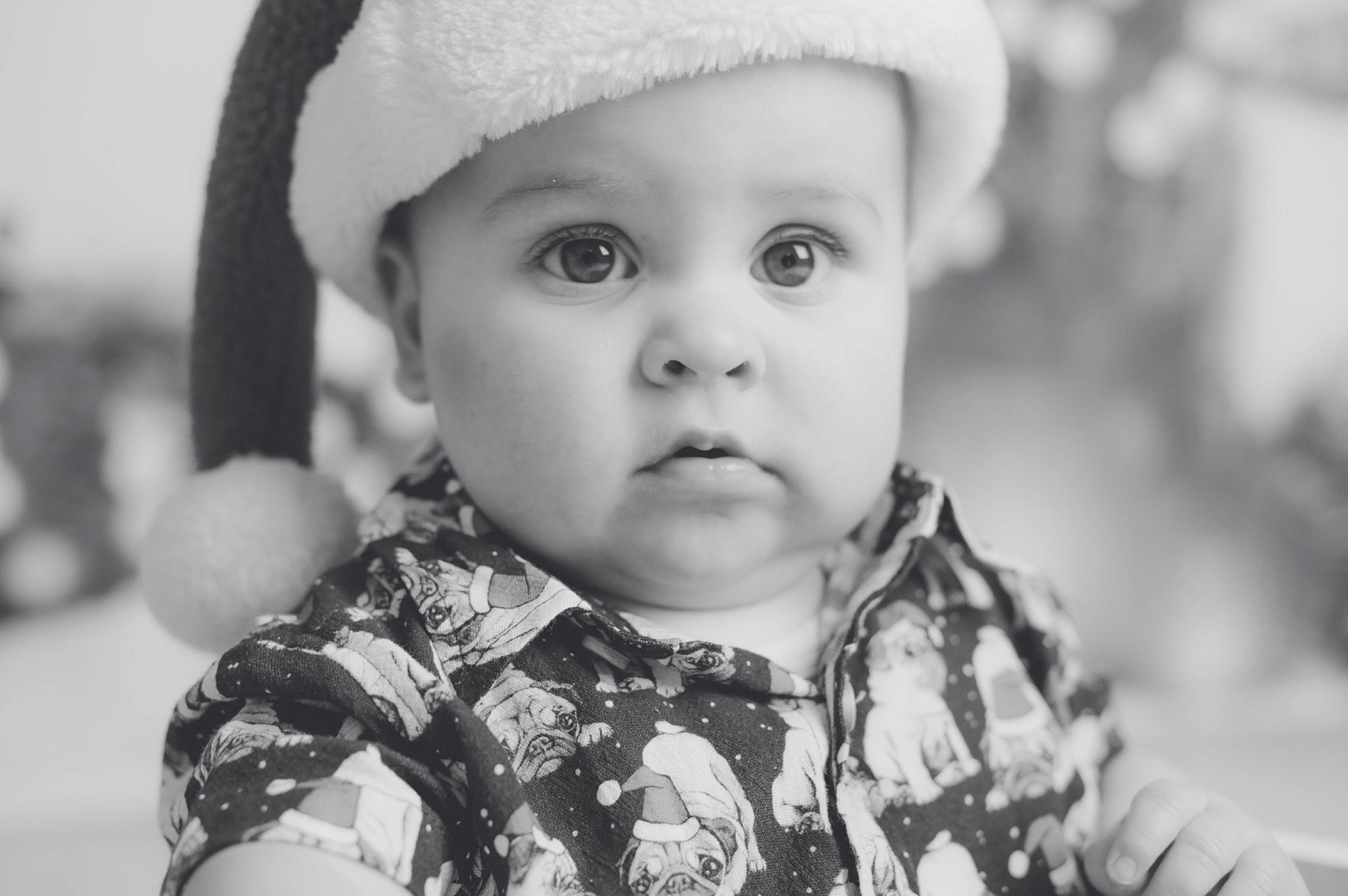 Noah is registered to the contest to win money with this photo: baby, black, black_and_white, cap, cheek, eye, eyebrow, flash_photography, happy, head, headwear, human, iris, lip, nose, organ, person, photograph, skin, smile