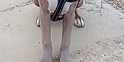 Buttercup is registered to the contest to win money with this photo: dog, puppy, blue_eyes, harness, sitting, outdoor, dirt, concrete, rust, pipe, curious, pet, canine, animal, ears, snout, fur, ground, young, attention