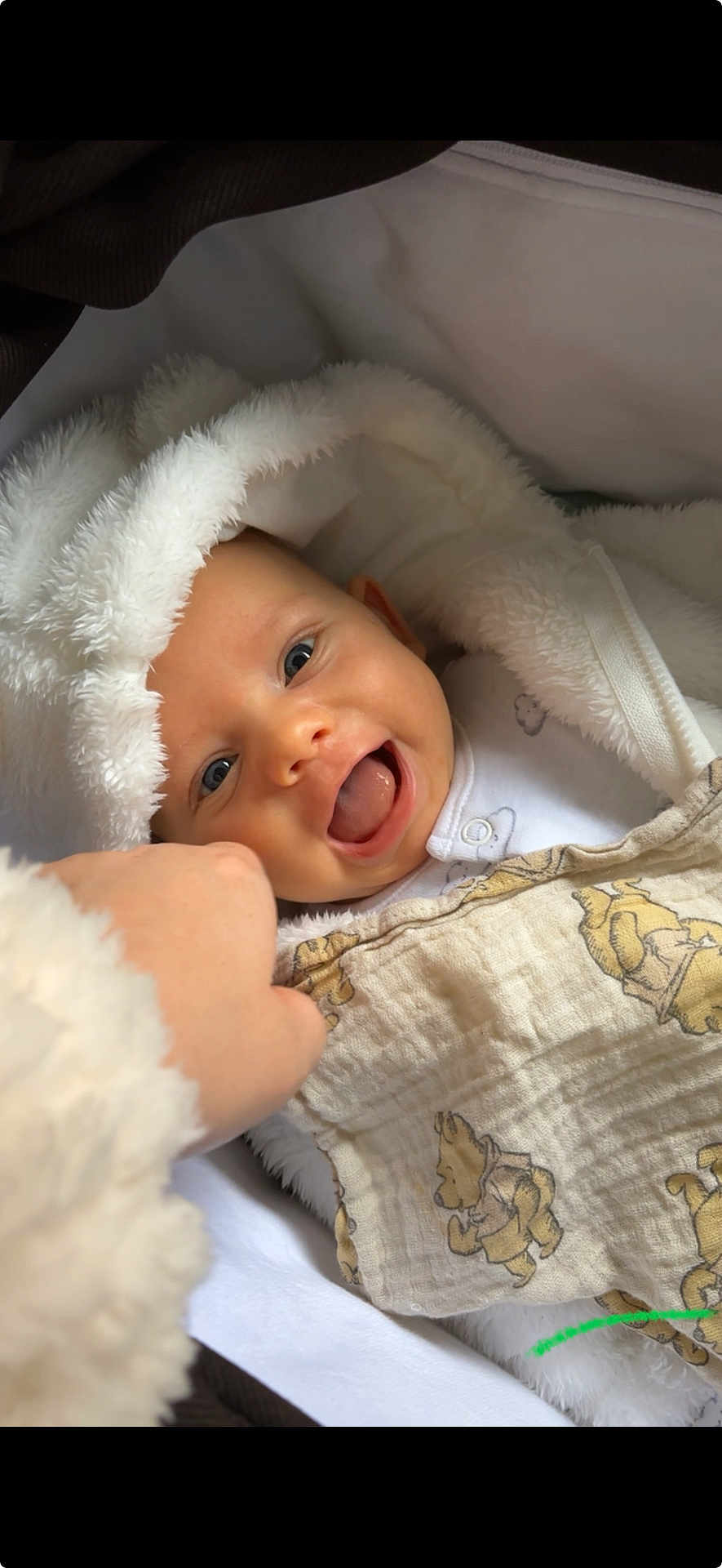 Charlie is registered to the contest to win money with this photo: baby, infant, smiling, blanket, white, hand, cozy, cute, happy, face, portrait, child, soft, warm, clothing, newborn, human, lying_down, toddler, expression