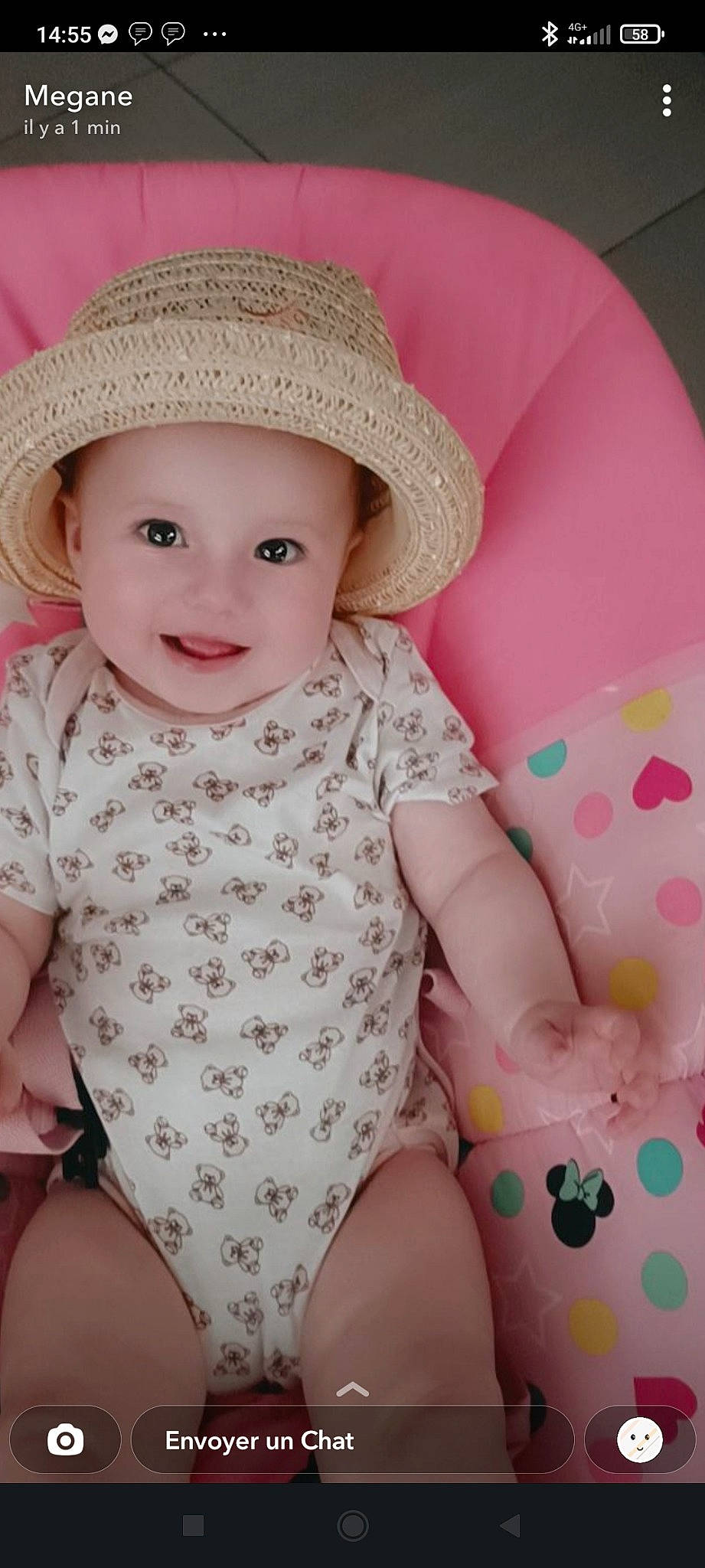Thaïs a rejoint le concours — aidez-le/la à gagner de superbes lots ! baby, baby_toddler_clothing, eye, face, facial_expression, happy, hat, head, headwear, joy, knee, lip, organ, outerwear, person, pink, skin, sleeve, smile, sun_hat