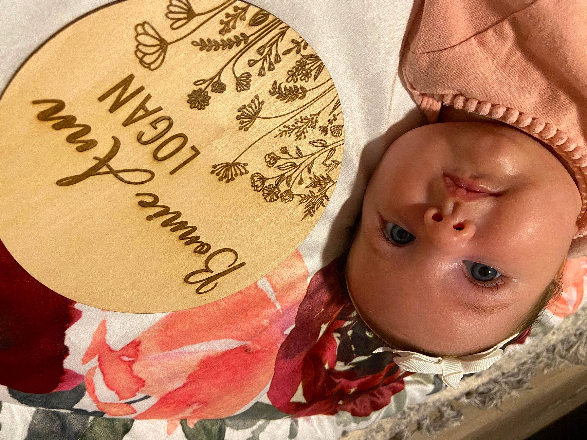 Bonnie Ann is registered to the contest to win money with this photo: baby, beauty, cap, cheek, circle, close_up, eyelash, fashion_accessory, font, hair_accessory, happy, headgear, headpiece, headwear, lip, material_property, pattern, person, petal, skin