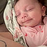 Kenzley joined the competition — help win amazing prizes! baby, sleeping, smile, blanket, floral, pink_clothing, infant, peaceful, child, human, portrait, closeup, cute, newborn, resting, soft, toddler, cozy, indoor, tattoo