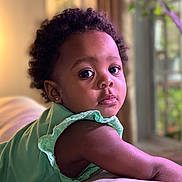 Kaylee Rose joined the competition — help win amazing prizes! baby, blackhair, bodypart, clothing, couch, dress, face, finger, frown, furniture, hair, hand, happy, head, person, photography, portrait, sad, sitting, smile