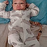 Elijah joined the competition — help win amazing prizes! baby, infant, onesie, whale_pattern, sleepwear, bed, pillow, blanket, lying_down, cute, relaxed, indoor, person, child, footed_pajamas, face, expression, small_toy, comfort, cozy